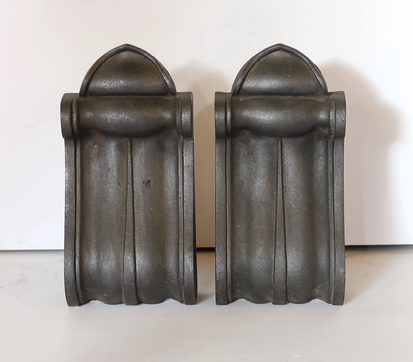 A pair of Victorian cast iron corbels and a pair of carved white marble corbels, height 26cm & 35cm